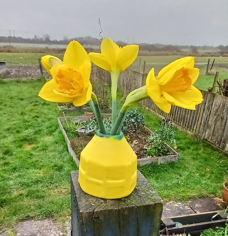 Small bright yellow bud vase 