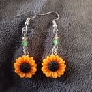 Sunflower charm dangle earrings with glass beads detail
