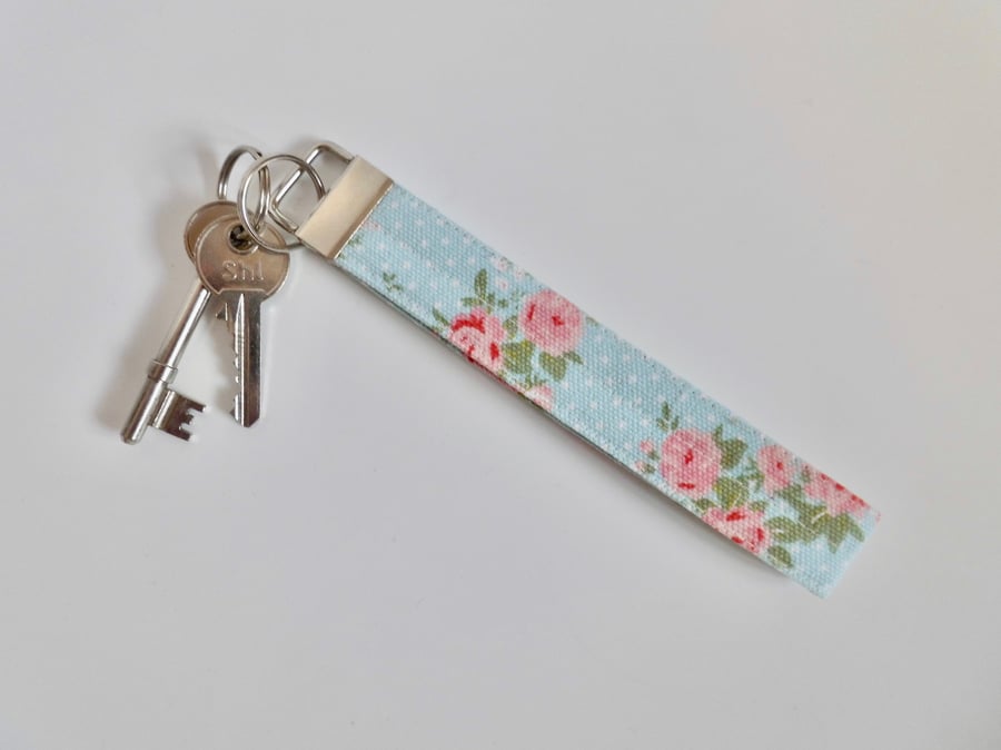 Key ring wrist strap in blue and pink floral fabric