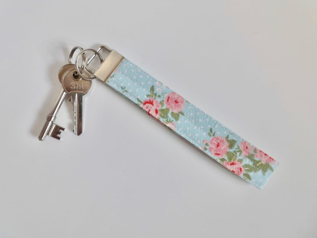Key ring wrist strap in blue and pink floral fabric