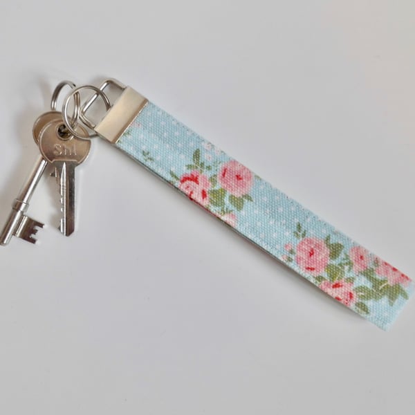 Key ring wrist strap in blue and pink floral fabric