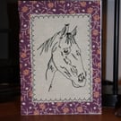 Horse head with a floral border