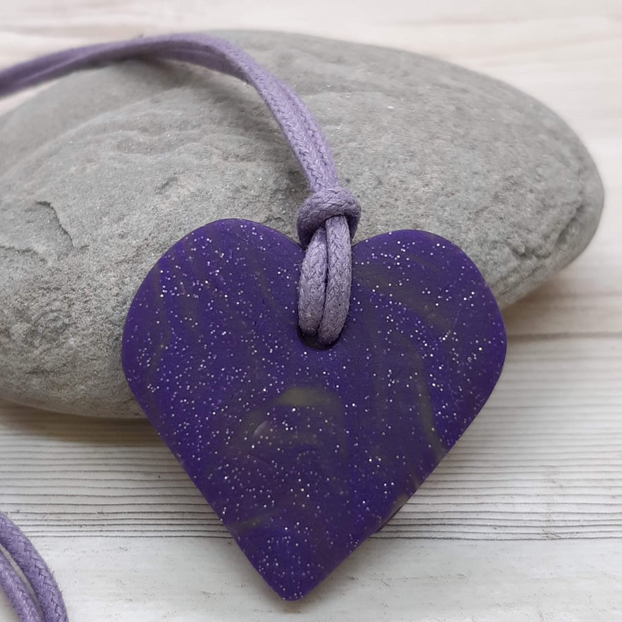 Heart shaped sparkly purple pendant
