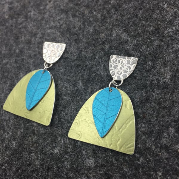 Handmade silver and aluminium textured earrings in turquoise and pale green