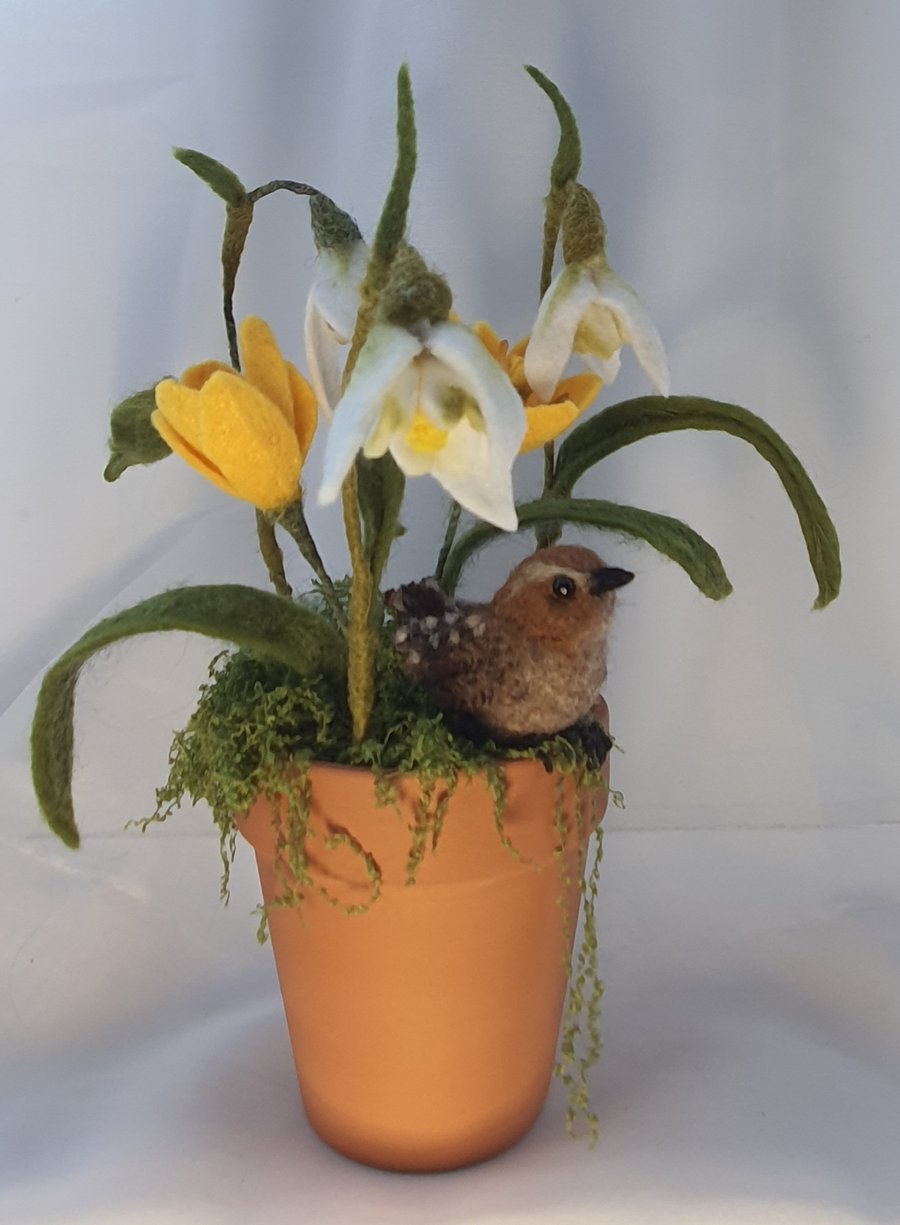 Needle felted Wren perched amongst felted snowdrops