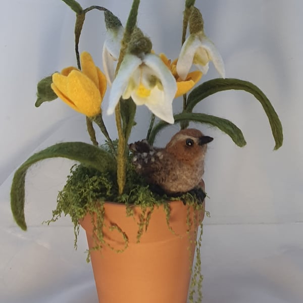 Needle felted Wren perched amongst felted snowdrops and crocus