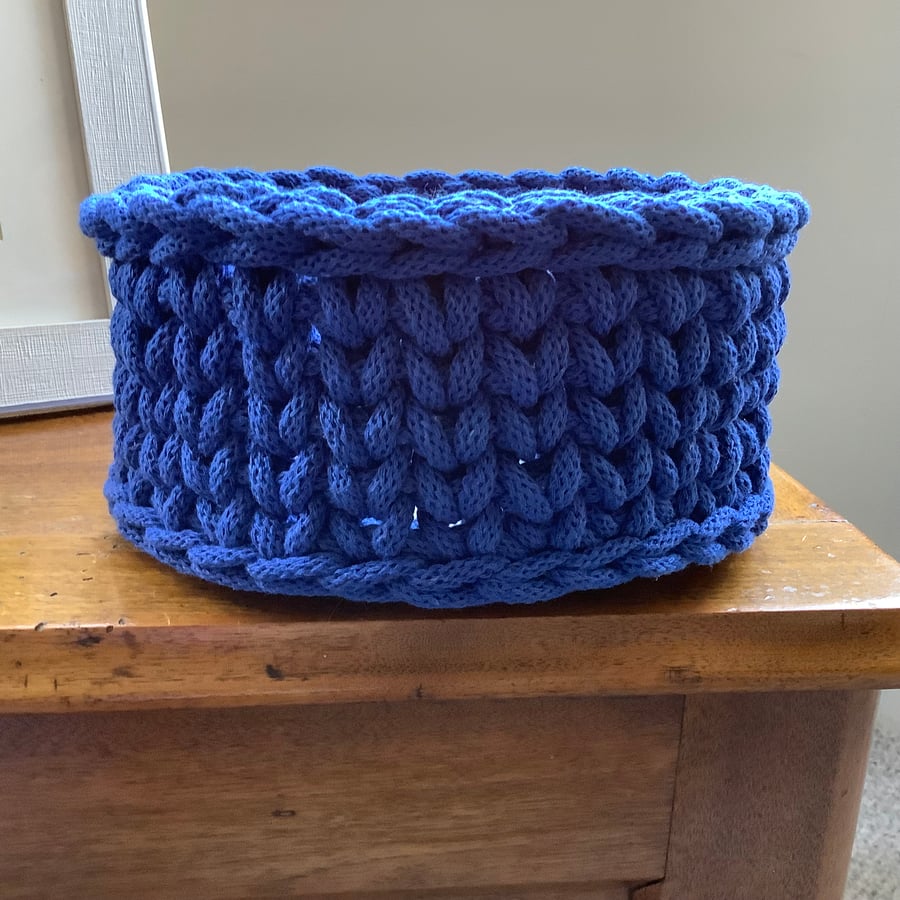 Crochet Storage Basket in Royal Blue with a Wooden Base.