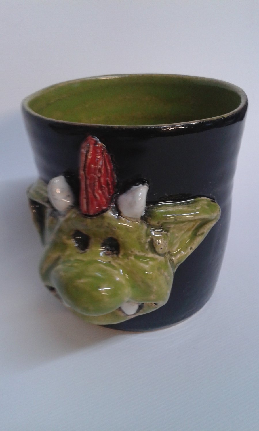Mug with Fungus the bogeyman's son Mould, moulded on the side.