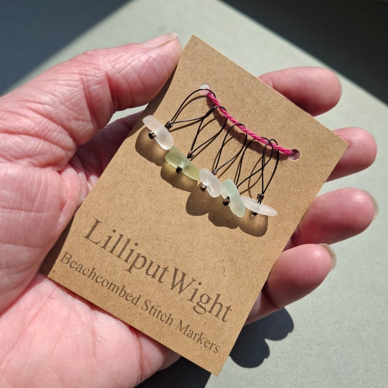 Five sea foam and white sea glass stitch markers