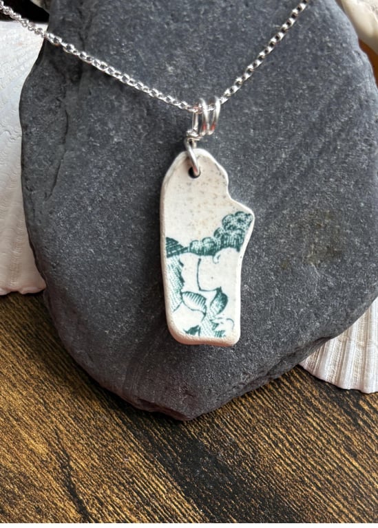 Sea pottery necklace, green design, smooth natural shape.