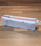 Pencil case - light pink and light green with pink zip, blue charm, and bobbles - Image 1