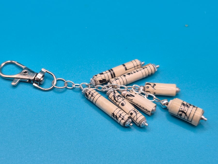 Paper beaded keyring made with recycled music sheets