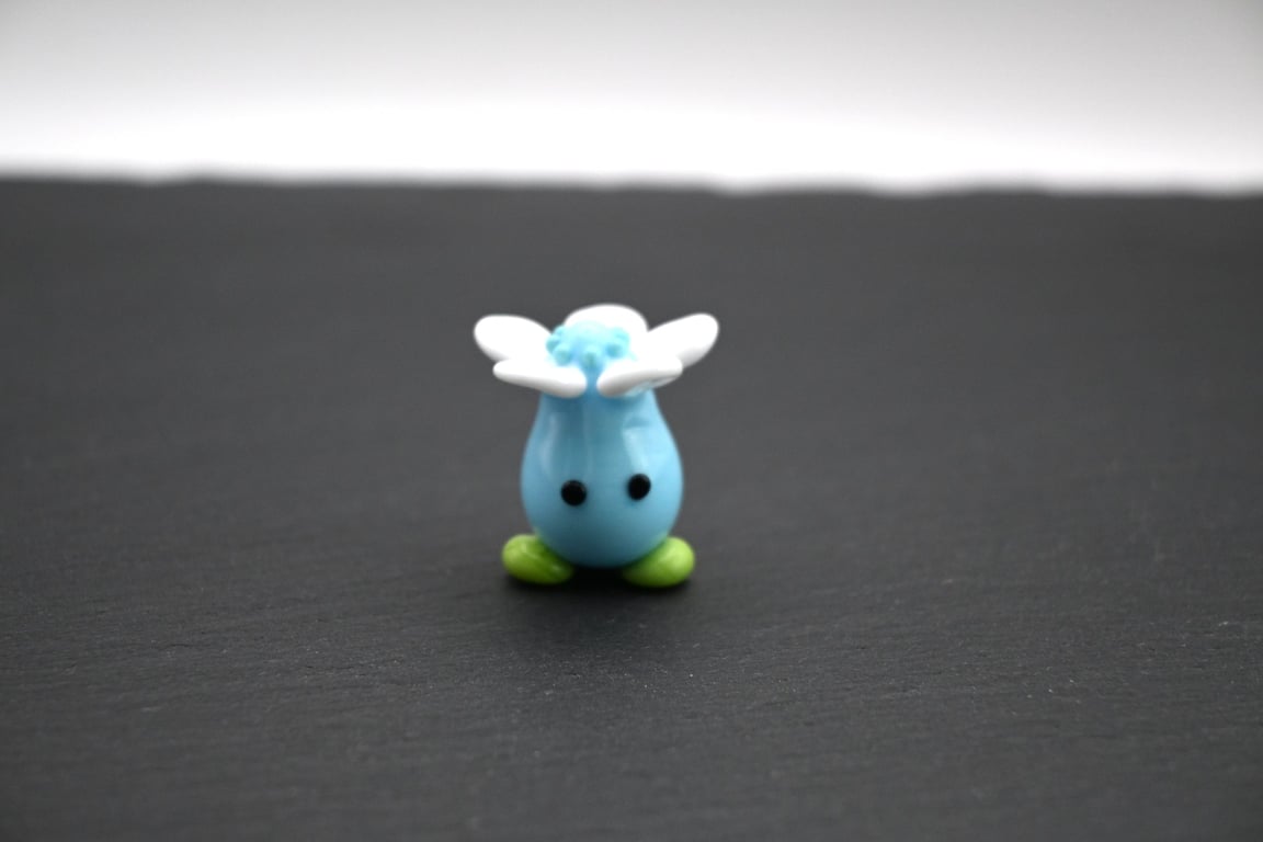 blue glass flower head figure