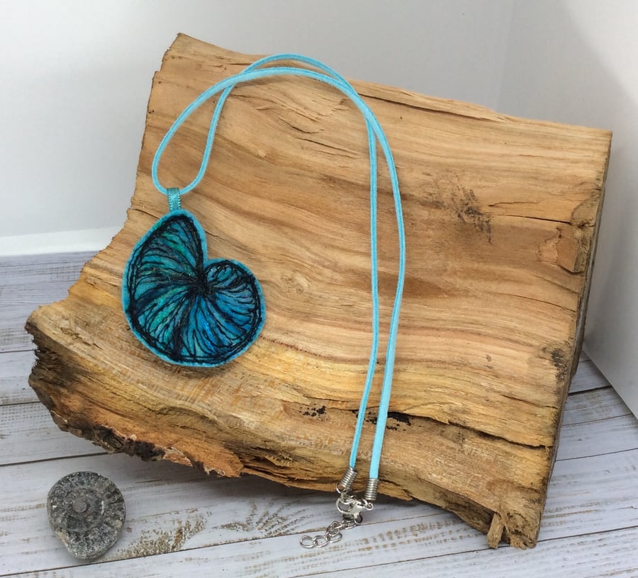 Embroidered needle felted nautilus necklace. 