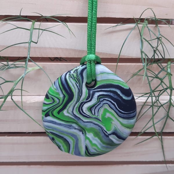 Green, black and silver polymer clay pendant