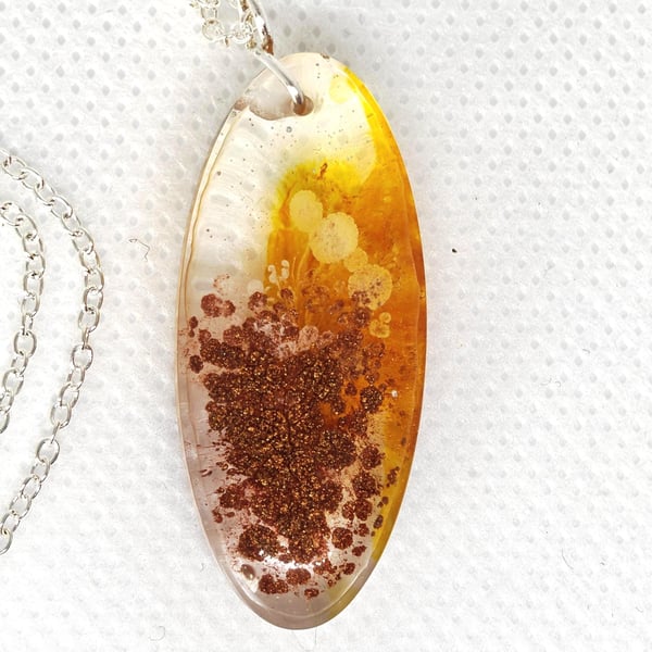 Golden Burst Resin Necklace: Handmade Amber Glow Pendant, Copper Sparkle
