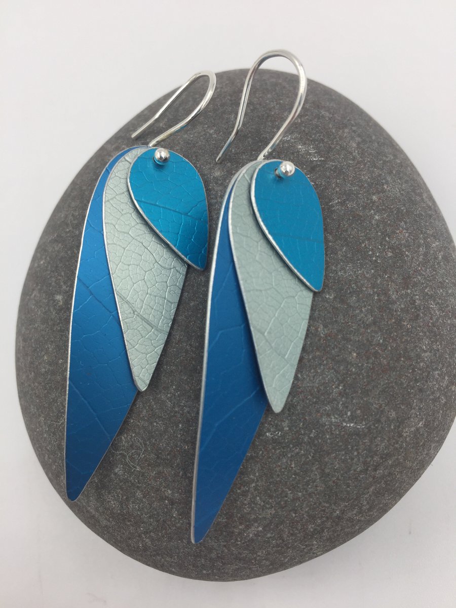 Anodised aluminium 3 layer parrot wing earrings in blue, silver and turquoise.