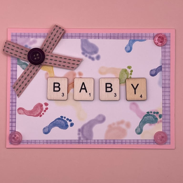 Baby card with cute footprints and wooden letters