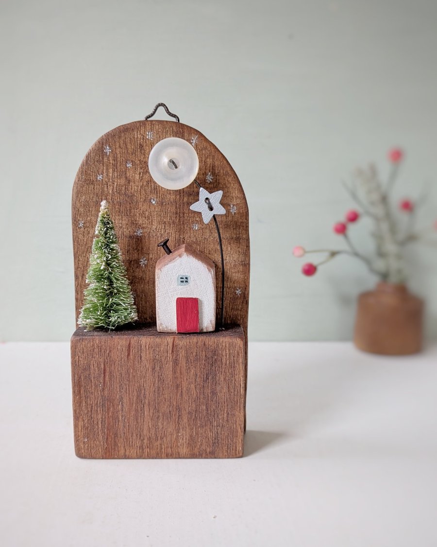 Image of Festive Wooden Cottage Scene with Tree and Button Moon