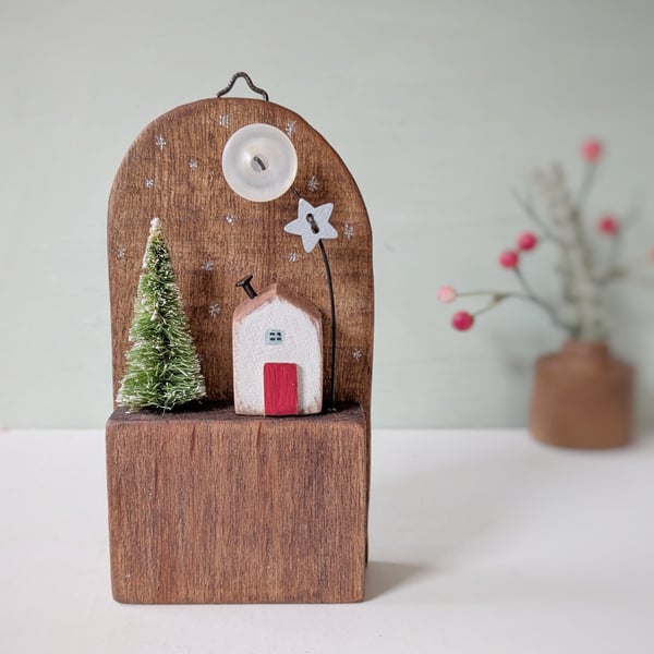 Festive Wooden Cottage Scene with Tree and Button Moon