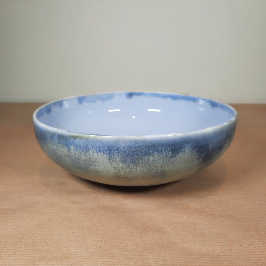 A hand thrown blue ceramic pottery salad serving bowl