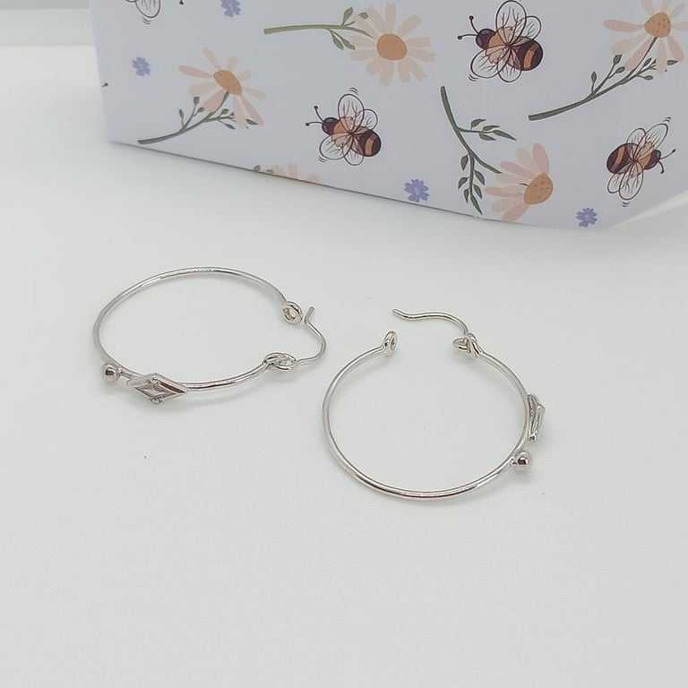 Sterling silver hoop earrings diamond bead design detailing 