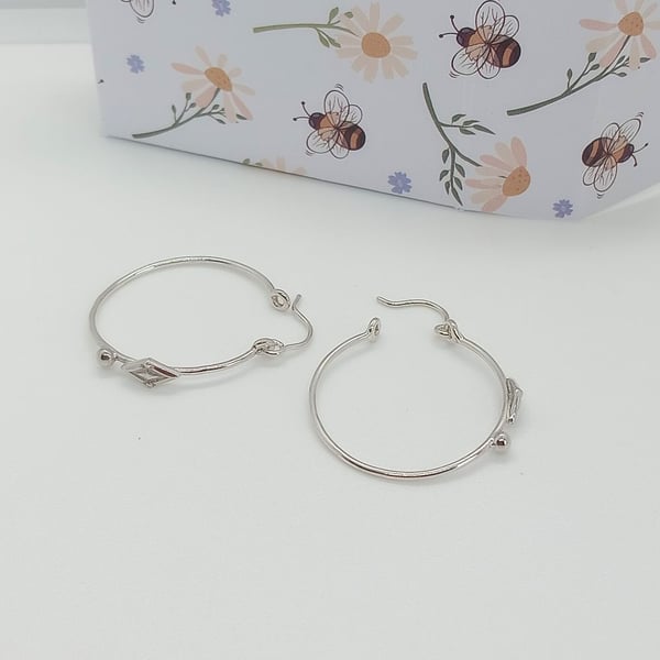 Sterling silver hoop earrings diamond bead design detailing 