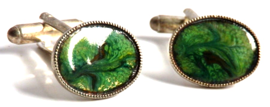 red-brown scrolled on green over clear enamel  - oval cufflinks 