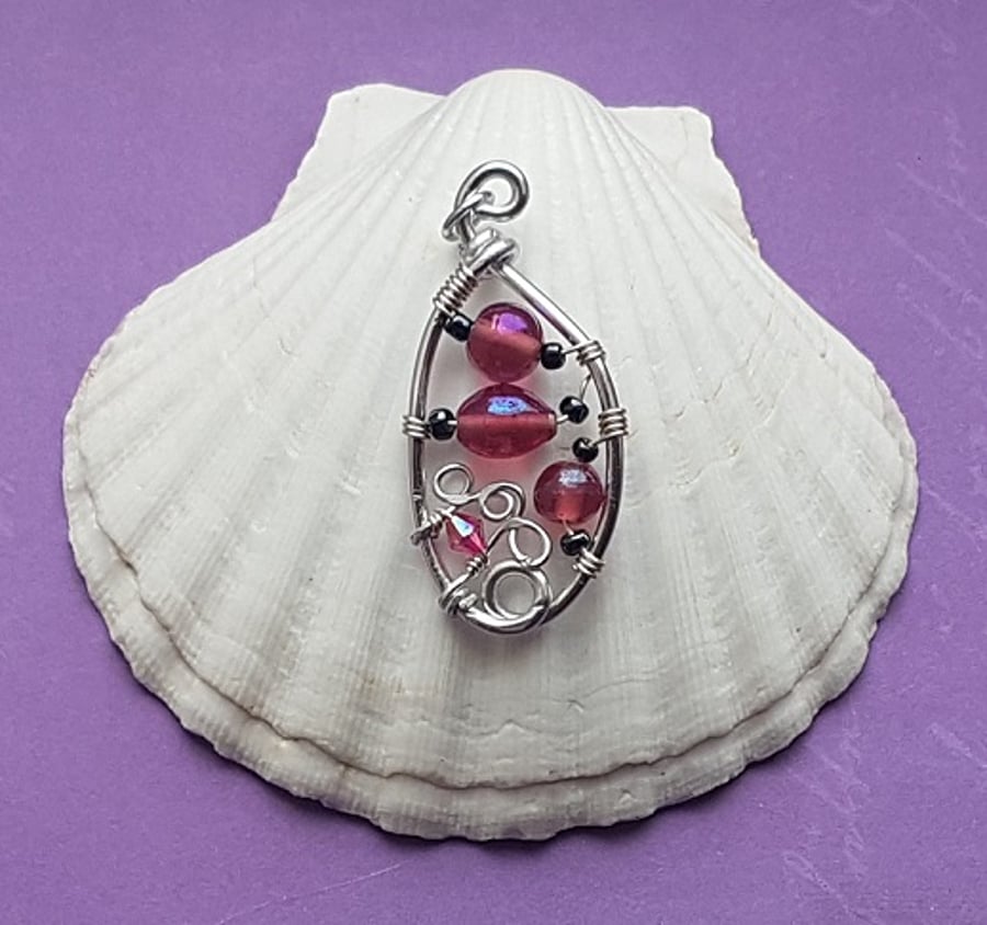 Abstract pendant with dusky pink glass beads