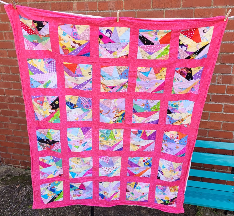 Homemade scrappy pink baby, child quilt.  53" x 44"