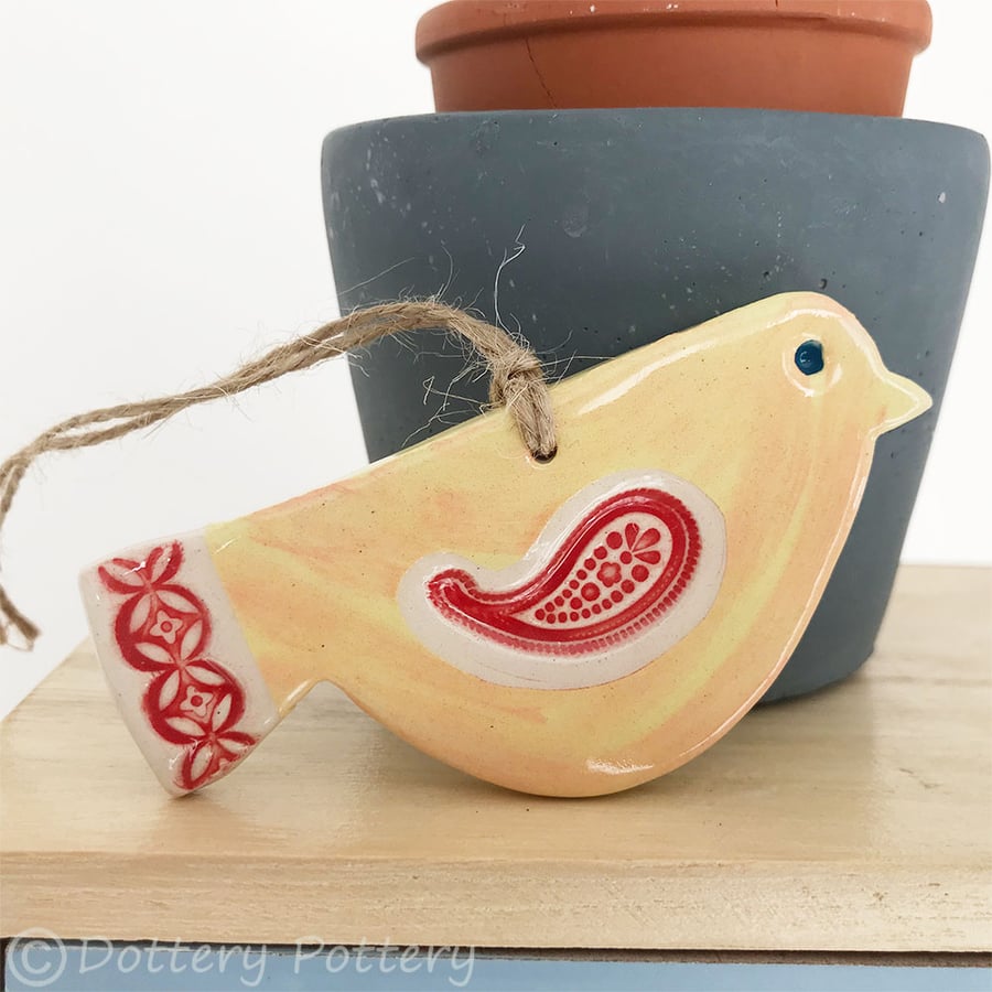Ceramic bird decoration with patterned wing and tail 