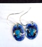earrings - small oval blue glass lump on blue enamel, silver wires