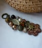 BROWN AND BRONZE FLOWER HANDBAG CHARM.  899 - Image 1