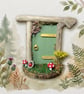 Handcrafted driftwood fairy door.