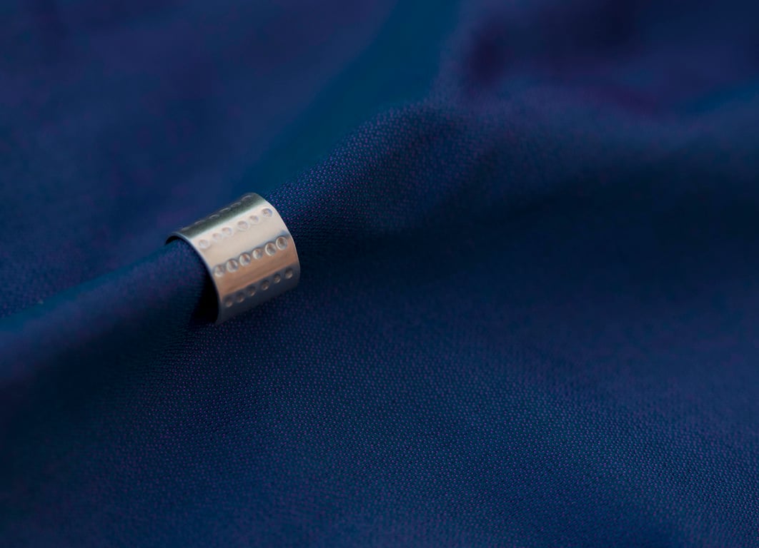 Chunky silver ear cuff with a "dimpled" design