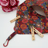 Raspberry pink dandelion burst, clip on peg bag. 