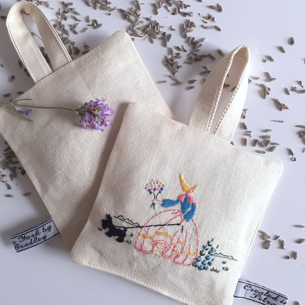 Lavender bag embroidered with a crinoline lady on vintage linen  