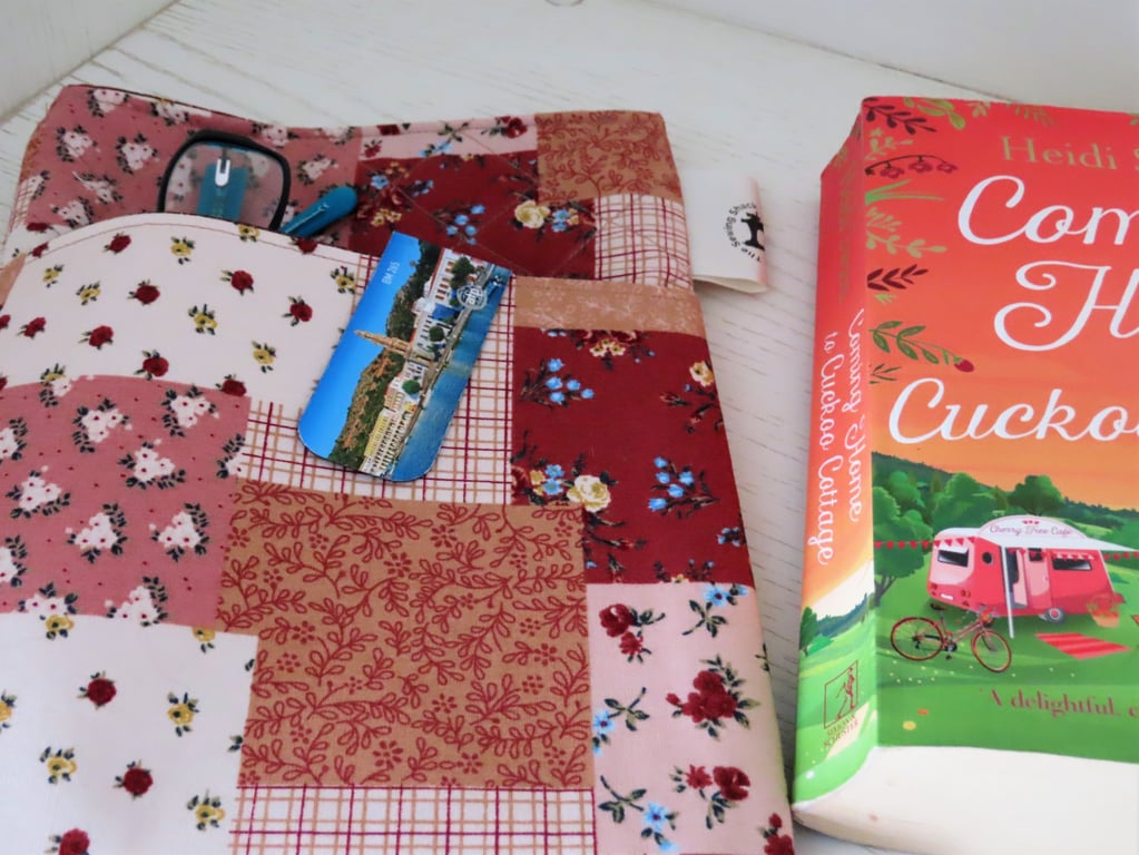 Fabric, Quilted Book Sleeve with Front Pocket.