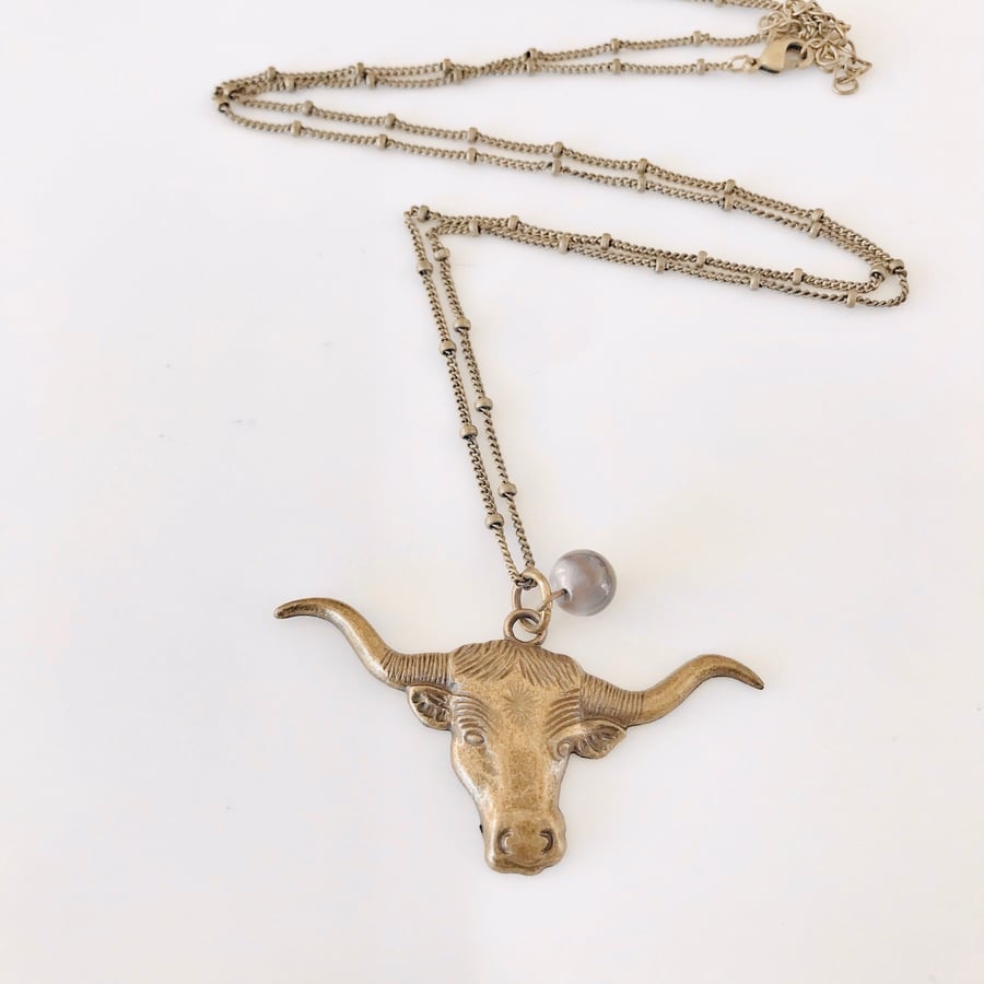 Brass cow pendant necklace with Botswana agate bead