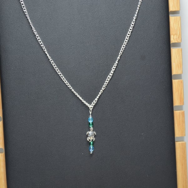 Silver Turtle charm necklace with green and blue glass beads