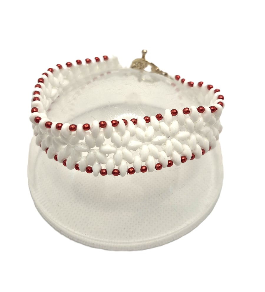White superduo bead flower pattern bracelet with red faux pearl edging