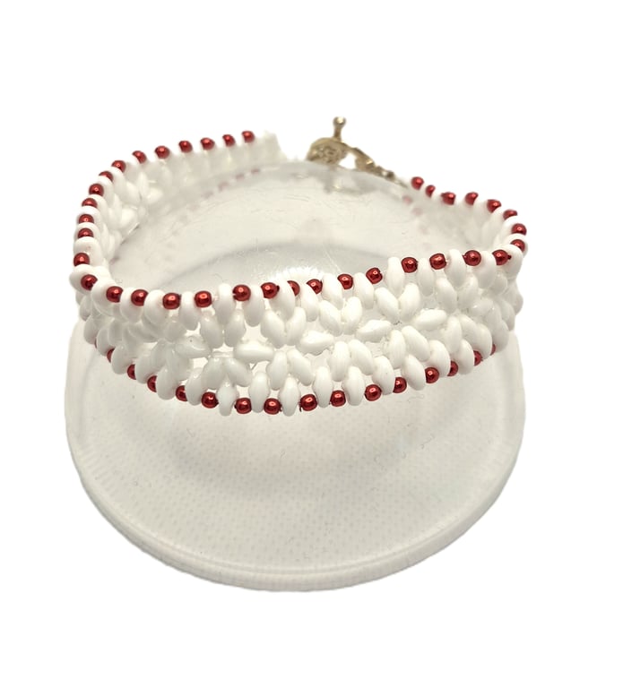 White superduo bead flower pattern bracelet with red faux pearl edging