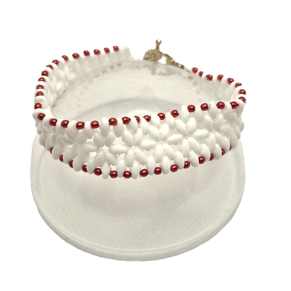 White superduo bead flower pattern bracelet with red faux pearl edging