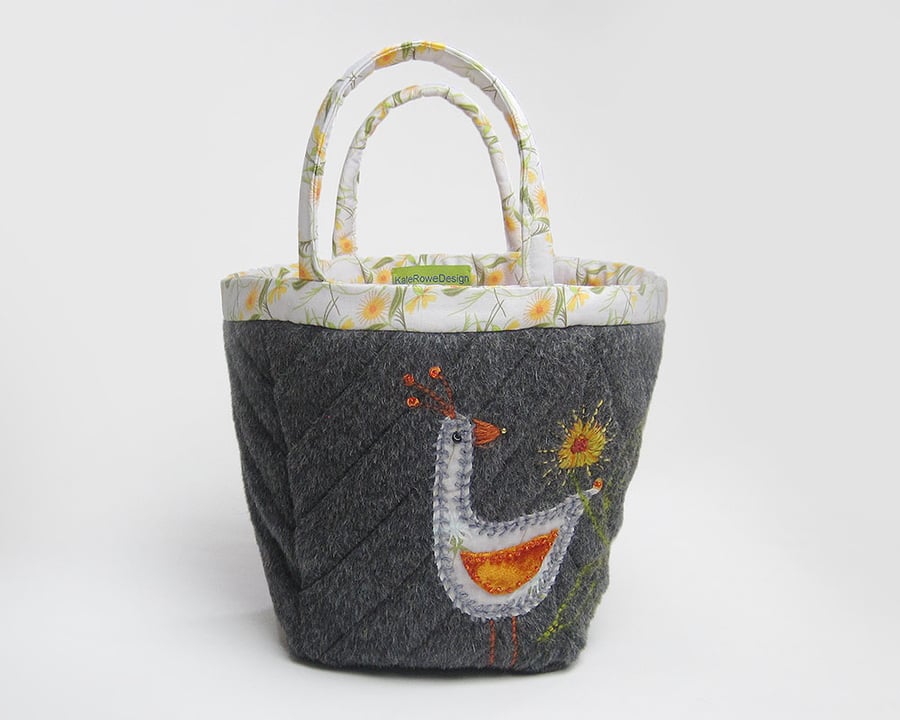 Charcoal grey project bag with appliqué bird and marigold embroidery