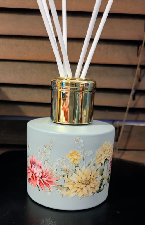 Grey floral themed glass 150 ml size diffuser bottle with reeds sticks.