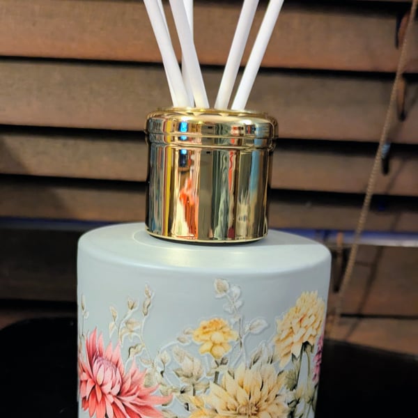 Grey floral themed glass 150 ml size diffuser bottle with reeds sticks.