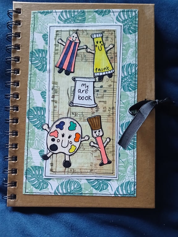 Quirky art art, whimsical decorated sketch book with quirky art character