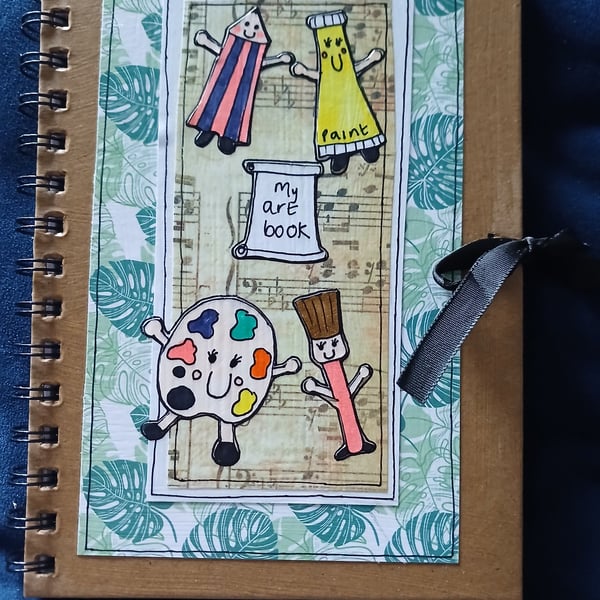 Quirky art art, whimsical decorated sketch book with quirky art character