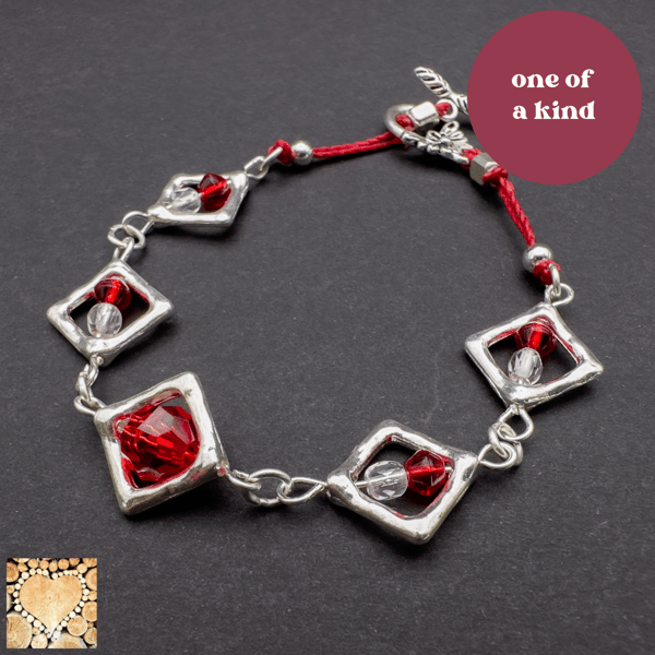 Silver and red diamond link bracelet