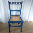 Upcycled vintage chair in blue chalk paint, hearts design, re-caned seat